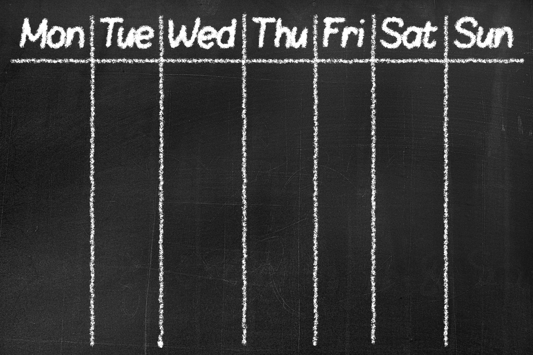 Blackboard with the text 'Monday, Tuesday, Wednesday, Thursday, Friday, Saturday, Sunday '